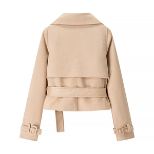 Back view of a beige faux suede cropped jacket with waist belt and wind flap detail