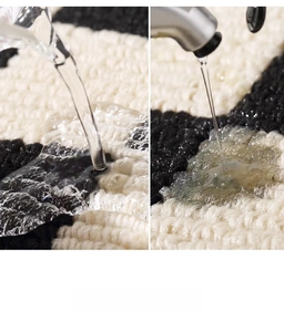 Macro shot showing high water absorption on black and white woven kitchen mat texture