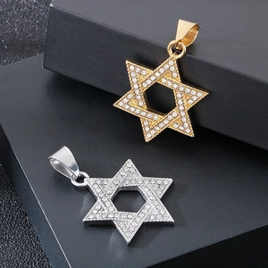 Detailed view of gold and silver hexagram pendants set with sparkling zircons