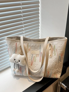Large cream canvas tote bag with colorful embroidery and a cute cloud plush pendant