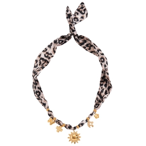 Vintage leopard print choker with gold sun and cross charms on a white background