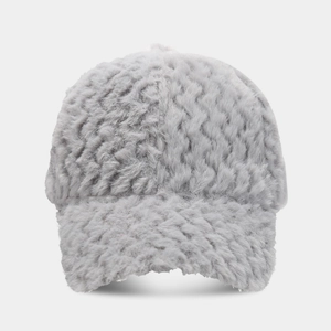 Close-up detail of grey fuzzy baseball cap featuring thick wavy faux fur texture