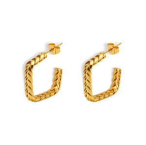 Detailed view of square gold earrings with intricate wheat ear woven metal texture