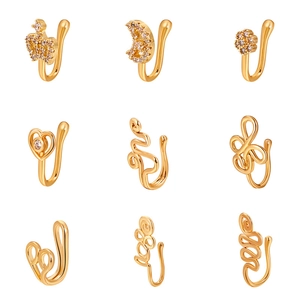 Nine gold non-piercing copper nose clips with star, heart and crown zircon designs