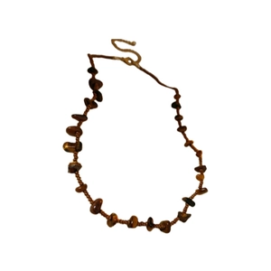 Maillard brown tiger eye stone bead necklace with retro metal S-hook clasp on white base