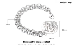 Detail of a gold stainless steel double chain bracelet with a 35mm Hamsa Hand pendant