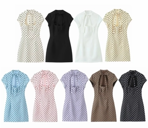Short sleeve mini dress with polka dot patterns and tie-neck detail in multiple colors