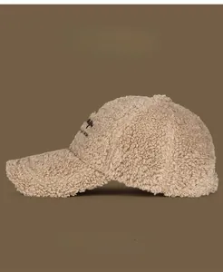 Detail of soft lamb wool texture and embroidery on camel fleece baseball cap