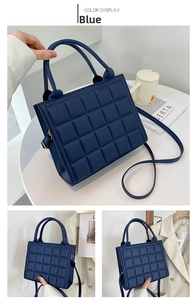 Detailed view of dark blue quilted handbag showing texture and crossbody strap options