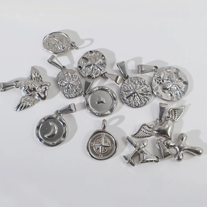 Set of 13 silver stainless steel pendants featuring angel, star, and heart motifs