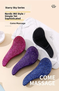 Set of four ergonomic star series massage hair brushes in sparkly pink blue and black