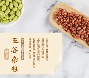 Realistic artificial green beans in white bowl and red beans on wooden tray models