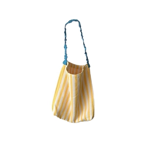 Fresh summer canvas tote bag with yellow stripes and blue pleated shoulder straps