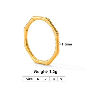 Detail view of 1.5mm wide golden minimalist bamboo style ring with 1.2g weight specifications