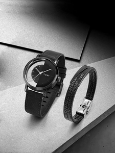 Detail of TOMI black leather watch set with hollow dial and matching bracelet