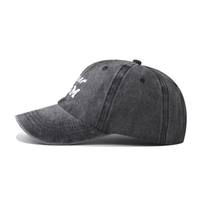 Macro detail of high-quality washed cotton baseball cap featuring side letter embroidery