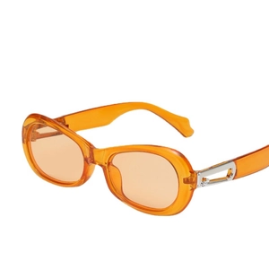 Trendy orange translucent oval sunglasses with silver metal hollow hinges on white background