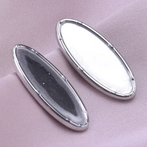 Detailed macro view of 304 stainless steel heart-shaped earring base components