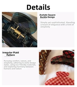 Detail of checkered acetate claw clip showing spring mechanism and pattern texture