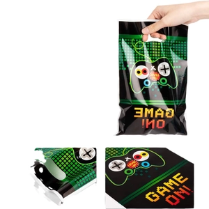 Green game themed party gift bag with pixel grid and controller handle for birthdays