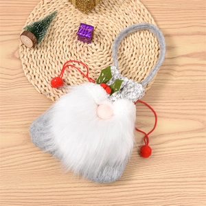 Close-up of a grey felt gnome Christmas drawstring gift bag with a plush white beard