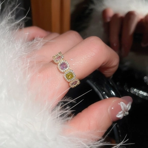 Macro shot of 14k gold plated ring featuring colorful zircon stones and micro-pave setting