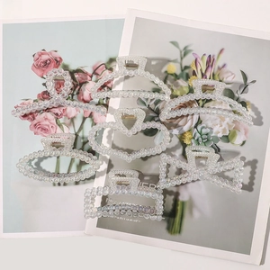 Detailed set of 6 pearl texture hair claws in various shapes on floral cards