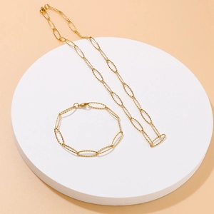Sparkling gold stainless steel necklace and bracelet set with geometric link design