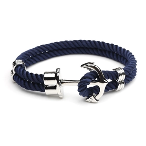 Navy blue braided anchor bracelet with silver metallic clasp on a white background