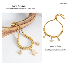 Detail of gold starfish and zircon pendants on beaded bracelet with adjustable slider