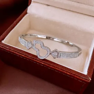 Luxury 18K gold plated hollow wulu bangle with pave micro-set white zircon stones