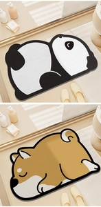 Gros plan de tapis de bain antidérapants en forme de panda et shiba inu, texture douce