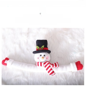 Detail of Christmas snowman curtain buckle with long flexible arms and red stripe scarf