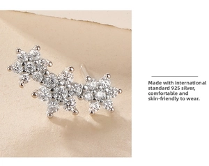 Macro detail of 925 sterling silver flower stud earrings with sparkling cubic zirconia