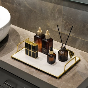Luxury bathroom vanity tray with marble texture and gold handles for cosmetics