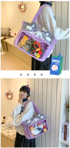 Detail of purple plush cat ita bag with transparent PVC window for doll display