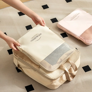 Travel compression storage bags set in beige and pink nylon with breathable mesh