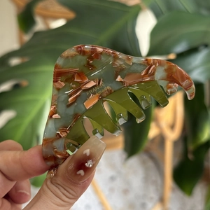 Handmade marble pattern hair claw clip with green and tortoiseshell design in acetate finish