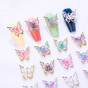 Detail of 3D gradient resin butterfly nail charms with hollow gold alloy frames