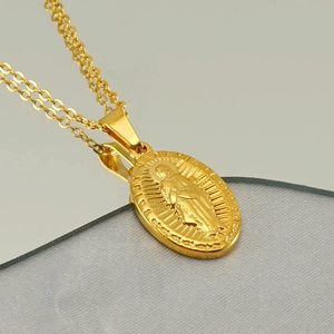 Gold Saint Benedict medal necklace in vintage stainless steel with religious relief