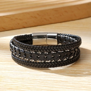 Macro shot of double-layer braided leather men's bracelet with stainless magnetic clasp