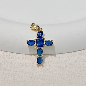 Cross necklace pendant in gold-plated copper with vibrant blue zircon stones