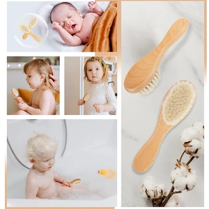 Detail view of baby hairbrush set with natural wool bristles and wooden handles for infants