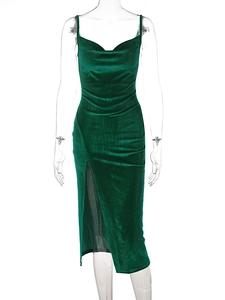Detail of dark green velvet midi dress with cowl neck and high side slit feature