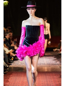 Detail of sexy strapless feather dress with pink ruffles, long gloves and stylish hat