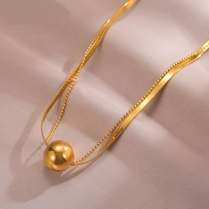 Golden double-layer titanium steel necklace with snake chain and polished ball pendant