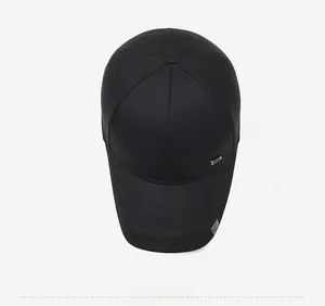 Top view of a black cotton baseball cap with silver metal logo and sport fashion label