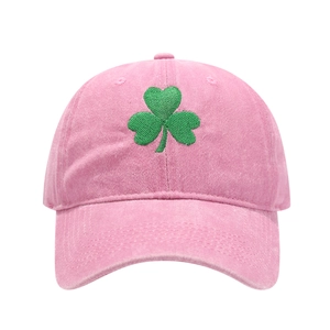 Unisex pink washed cotton baseball cap featuring a green three-leaf clover embroidery detail