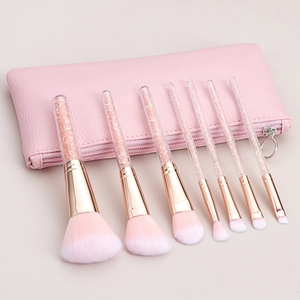 7-piece pink glitter makeup brush set with crystal handles and matching leather pouch