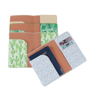 Faux leather passport covers with cactus and floral prints showing internal card slots